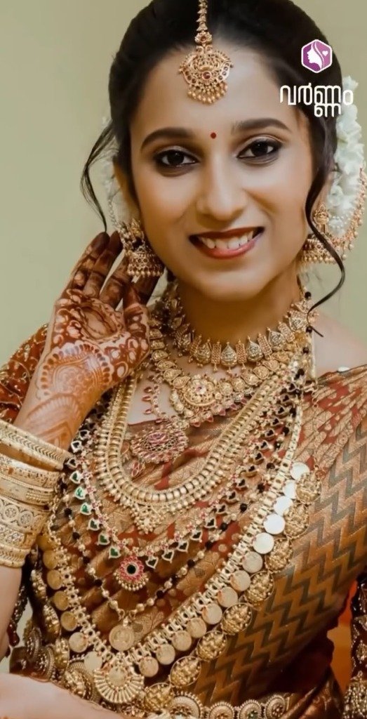 Traditional Crimson Saree Bride — Bridal work by Varnam Makeover Studio